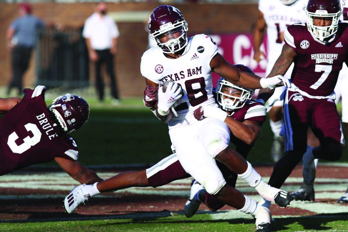 Mississippi State University’s sophomore safety Collin Duncan stops Texas A&M’s Isaiah Spiller in Saturday’s game where the Bulldogs lost 28-14.
