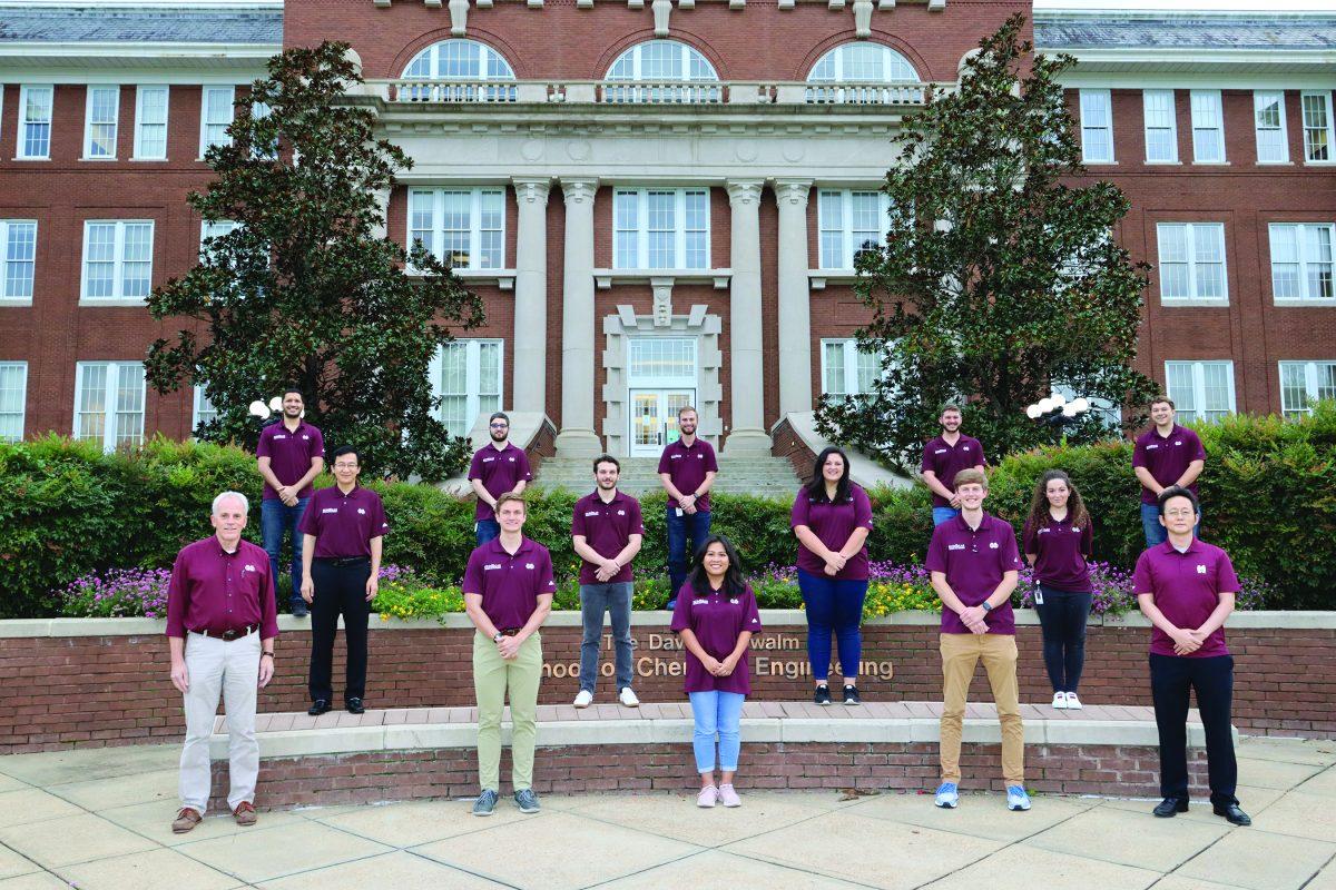 The MSU EcoCAR team poses in front of Swalm. The team is comprised of students from a variety of majors and offers hands-on experience vital for their future careers.