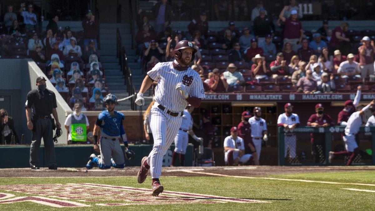 Junior utility player Luke Hancock rounds first while watching his solo home run leave the ball park against Kentucky this past weekend.