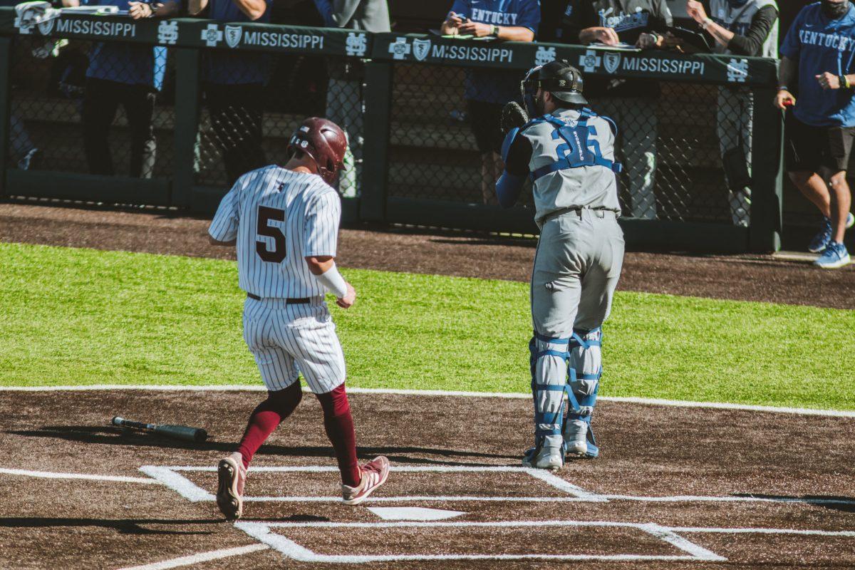 Tanner Allen steps on home plate during the Kentucky series this past season.