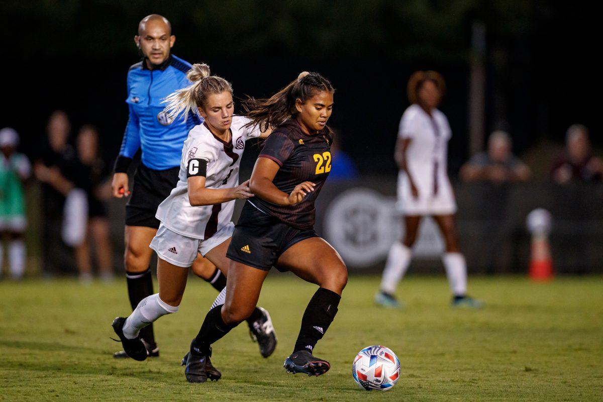 Sophomore Macy Hodge (4) chases down a Sun Devil in this past week’s game.