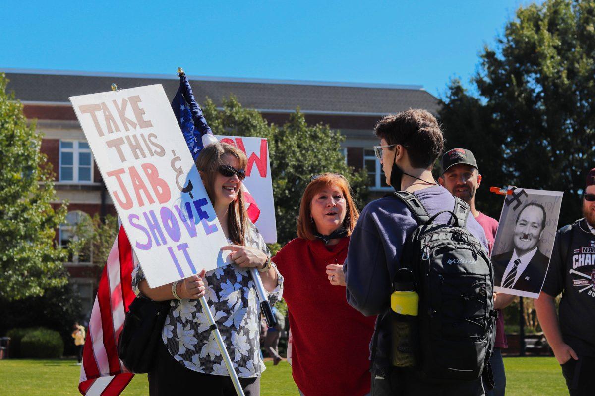 Protesters took to the Drill Field to march against the vaccine mandate imposed yesterday by the Institutions of Higher Learning.