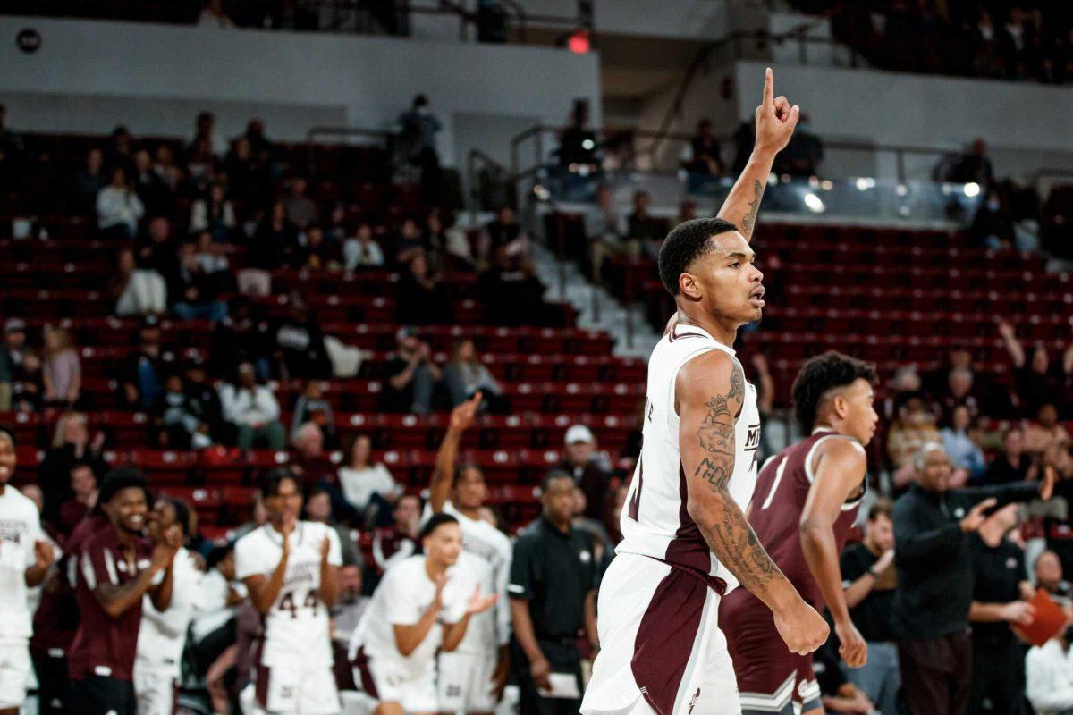 Shakeel Moore celebrates after dialing one up from three against Montana.