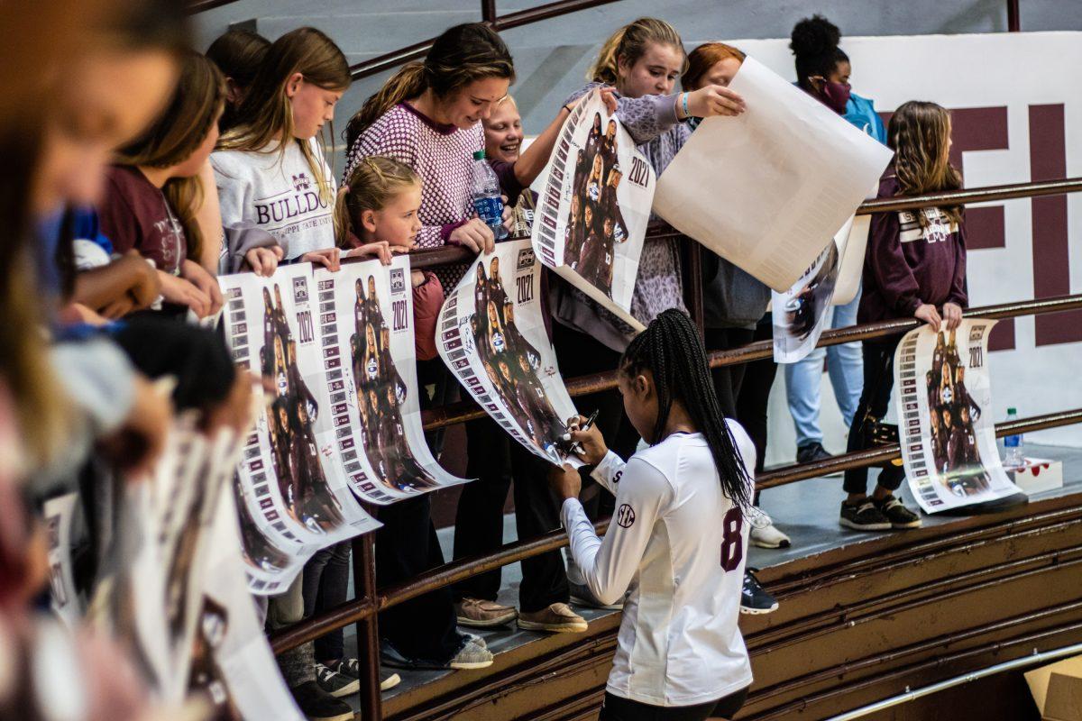 Senior Gabby Waden signs autographs after the teams historic win against the Tide.