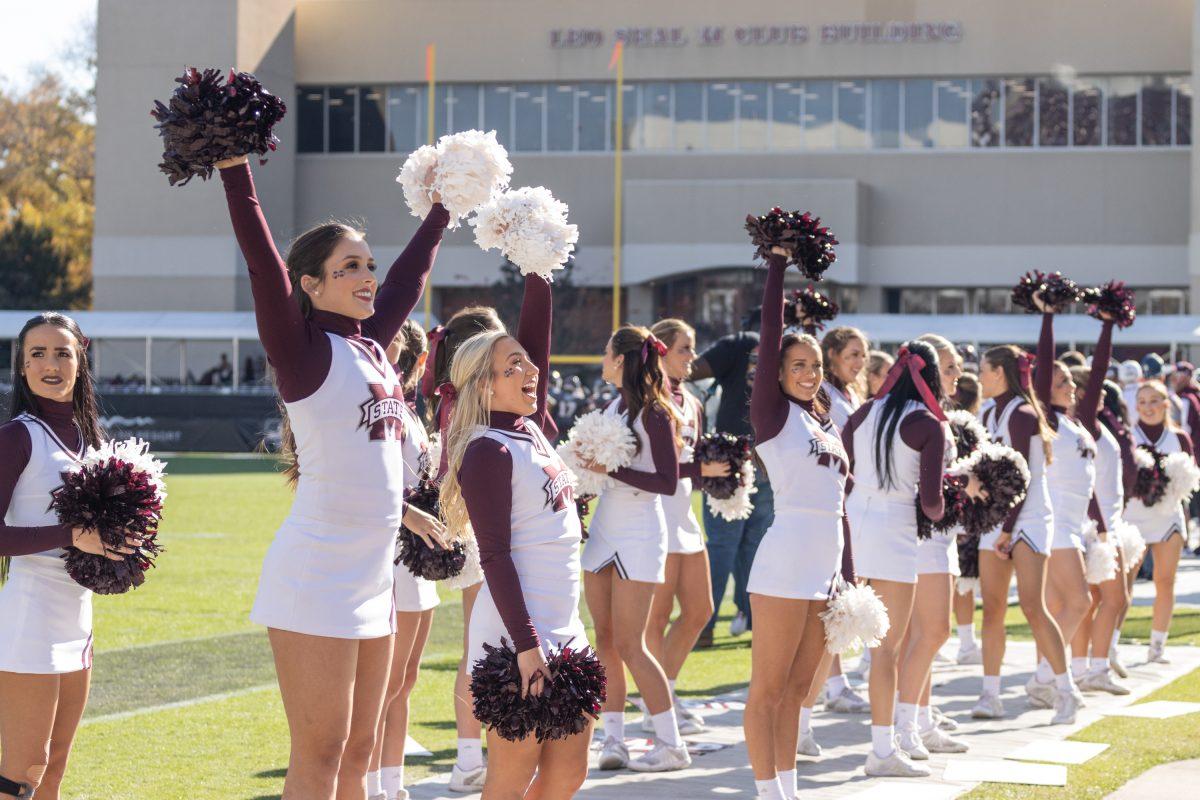 Members of the MSU all-girls cheer squad gather on the sidelines of Davis-Wade Stadium in support of the Bulldogs during the game against Tennessee State.