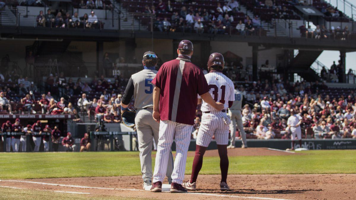 Riley Self and Tanner Leggett stand at first during the 2021 season game against Kentucky.