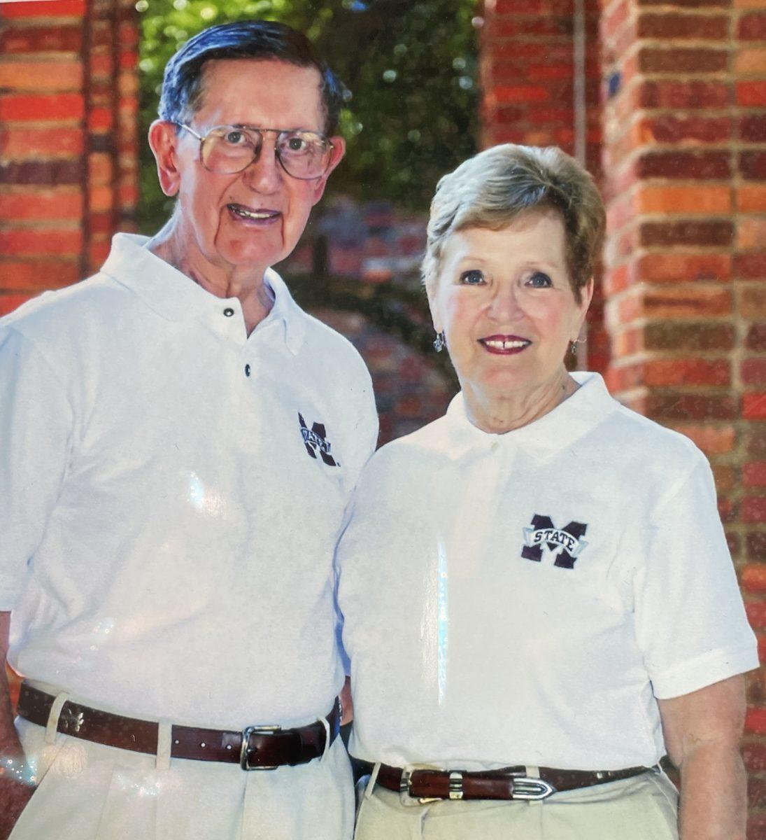 John and Jennie Fraiser pose for a photo wearing their beloved maroon and white.