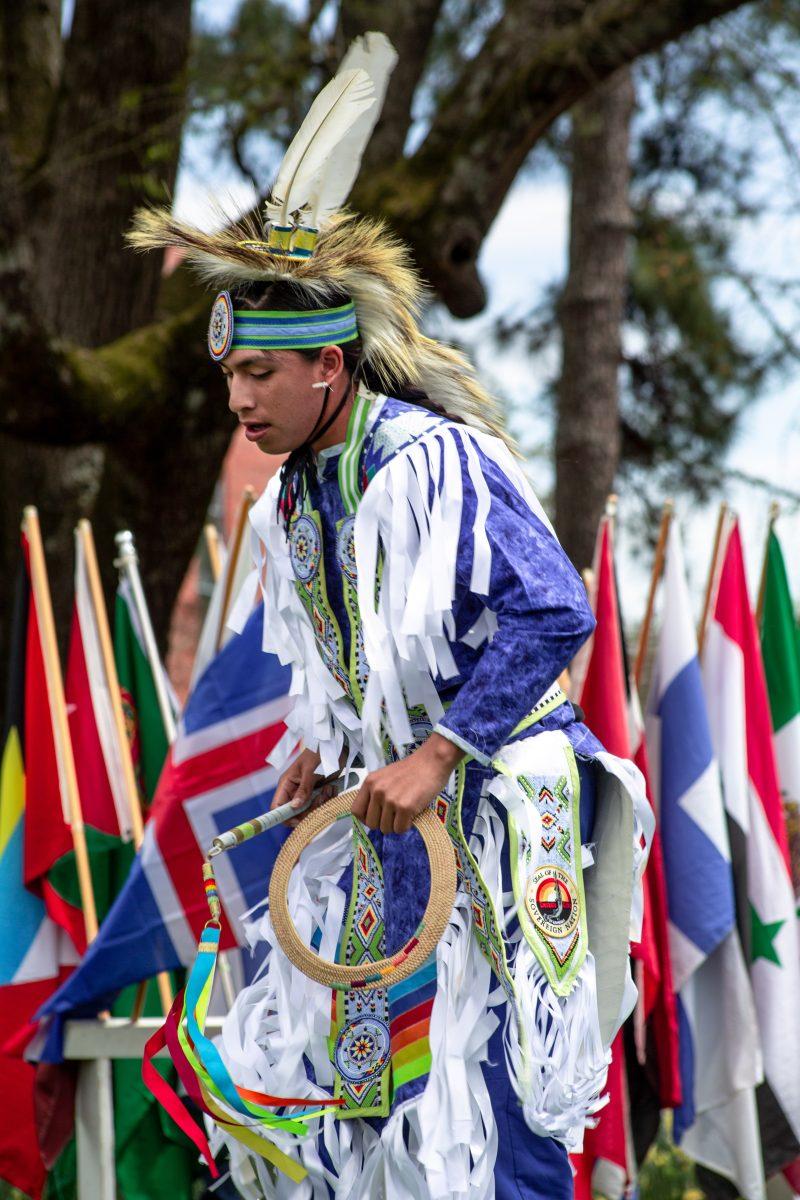 A person of Native American culture does a traditional dance at the 30th International Fiesta. 