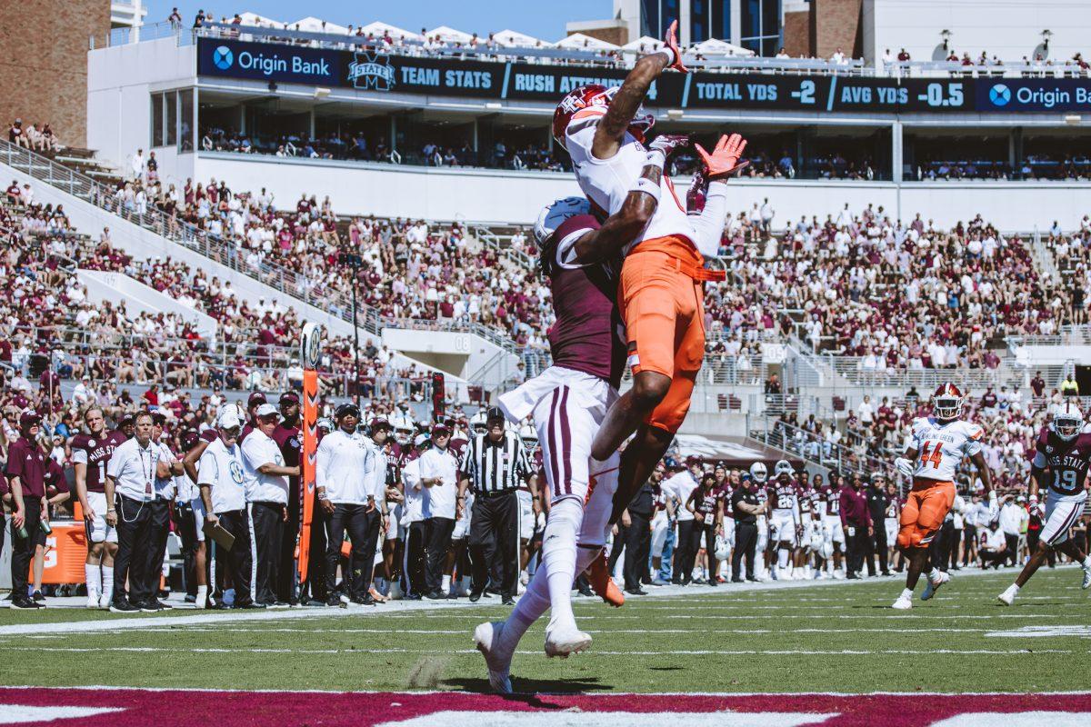 An MSU defender skies up with a Bowling Green wideout for a contested catch. 