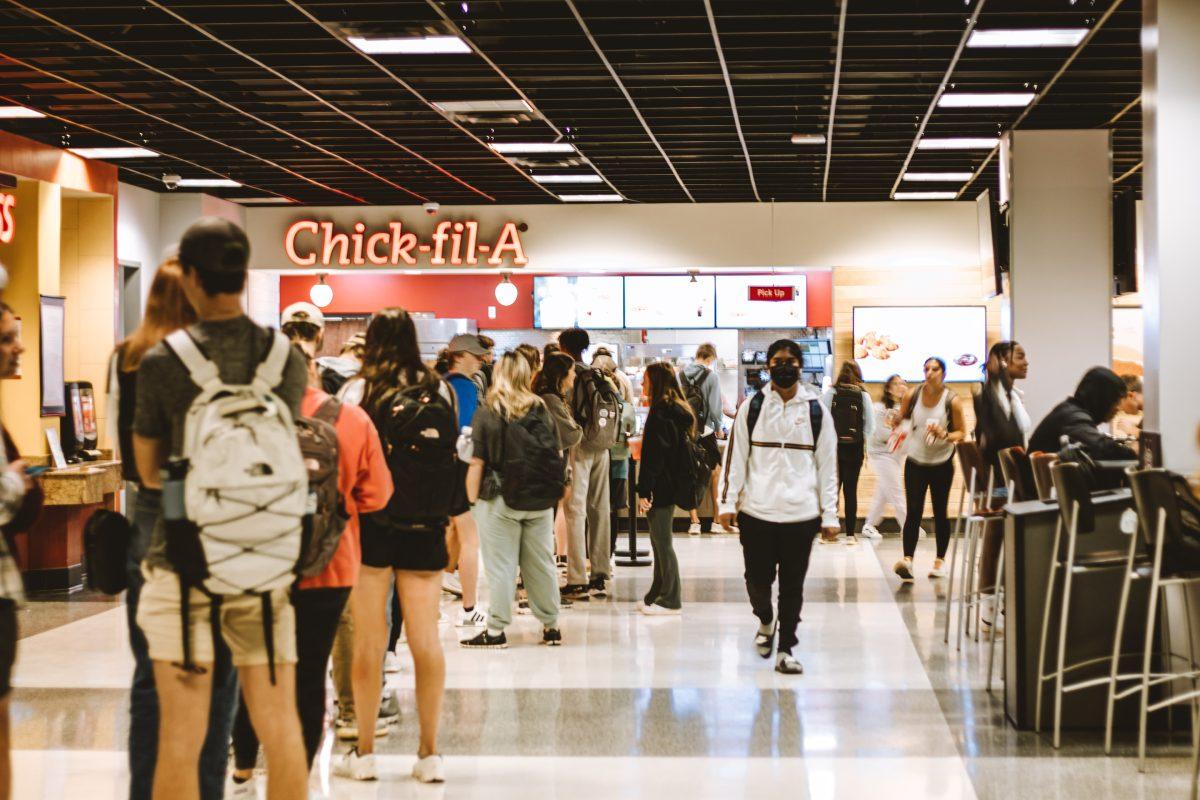 In the Colvard Student Union, students wait in line to grab food from Chick-fil-A. Students can pay for meals with block meals, flex dollars or a credit or debit card.