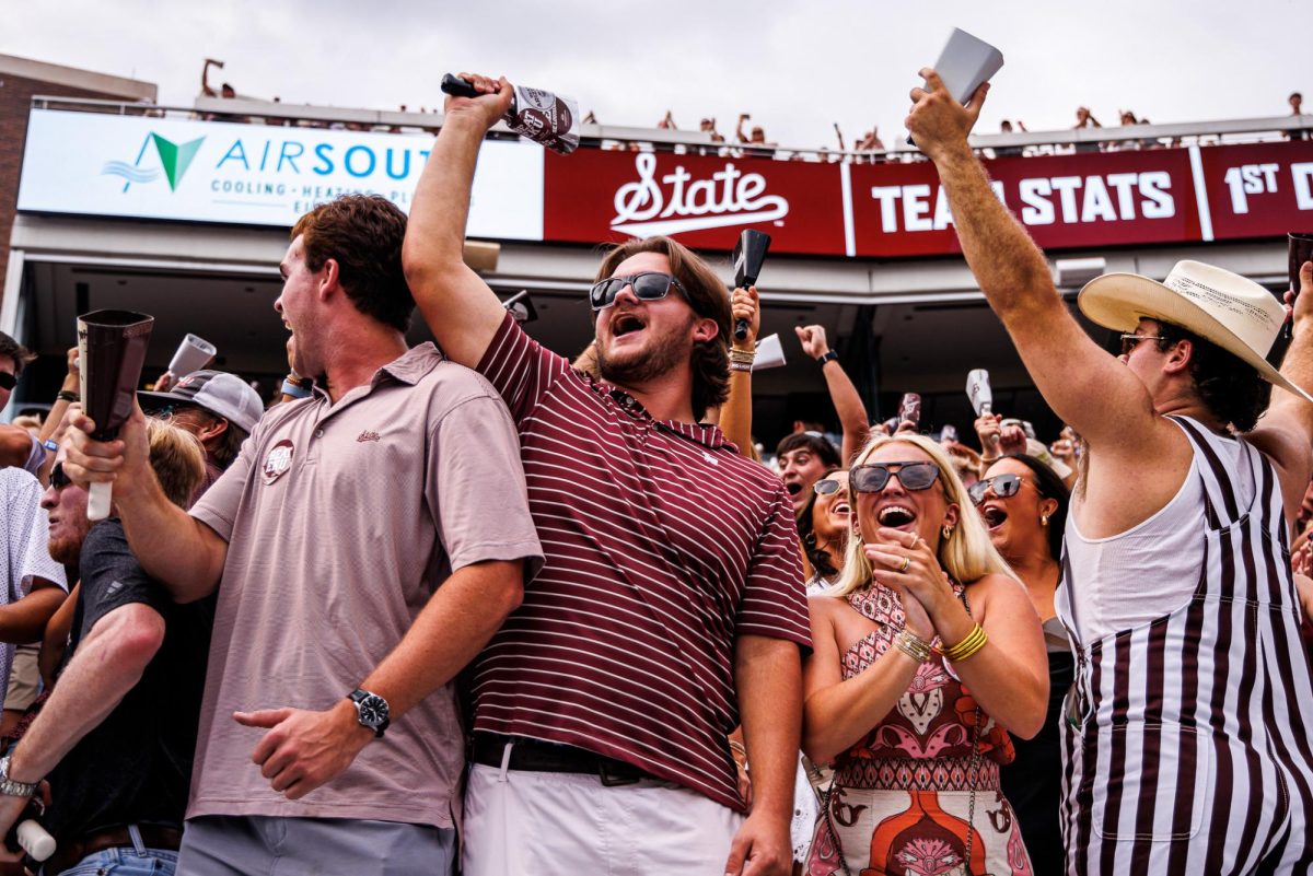 Students ring cowbells at the game against Eastern Kentucky.