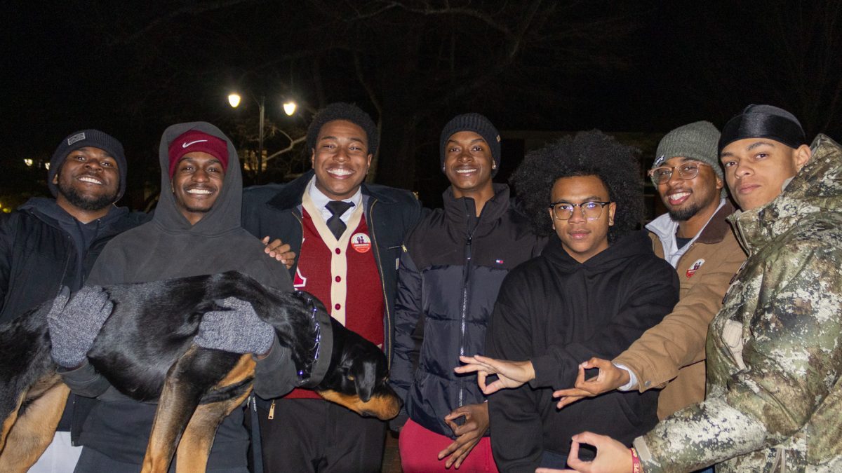 Cameron Cummings celebrates with friends and members of his fraternity, Kappa Alpha Psi.