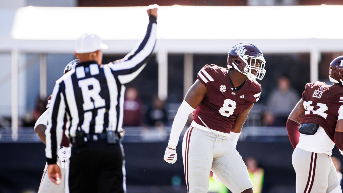Linebacker Malick Sylla exclaims with his fist down on the field during the 2025 Egg Bowl game. [Ivy Rose Ball/MSU Athletics]