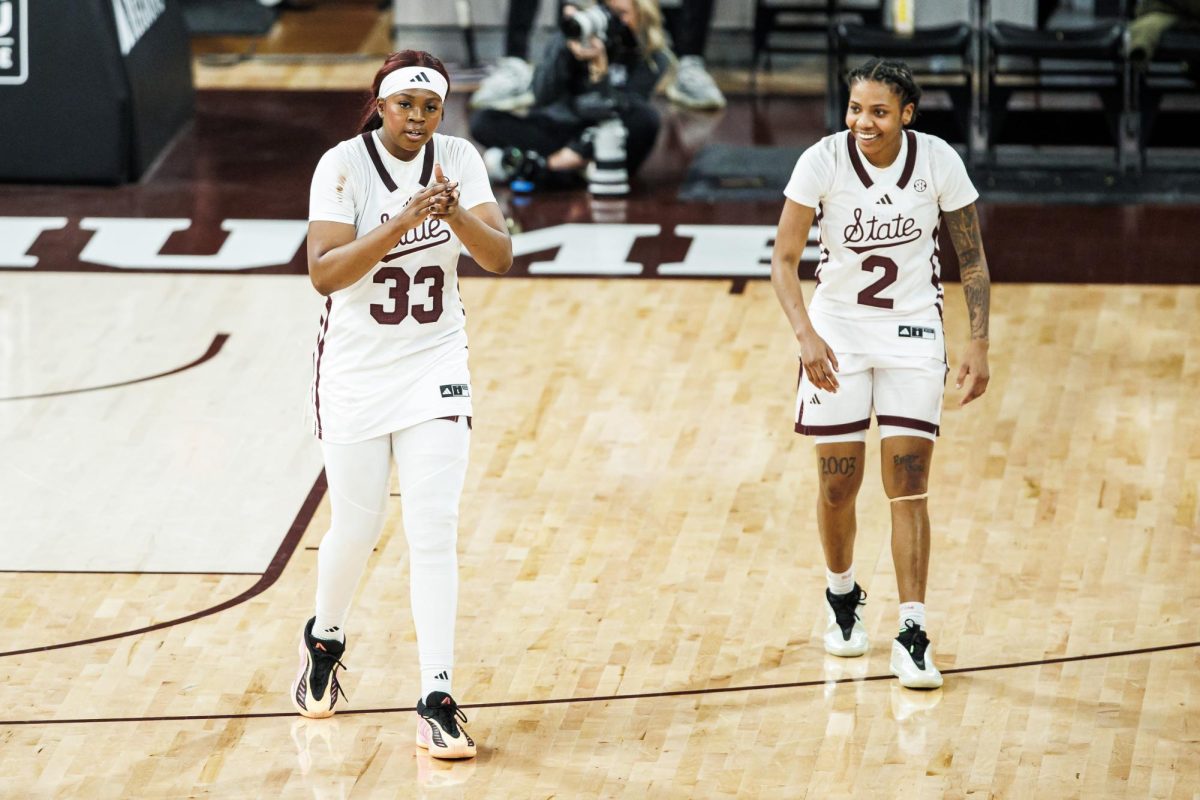 Mississippi State women’s basketball players Kharyssa Richardson and Destiny McPhaul celebrate together on the court in Humphrey Coliseum during the game against Kentucky.
