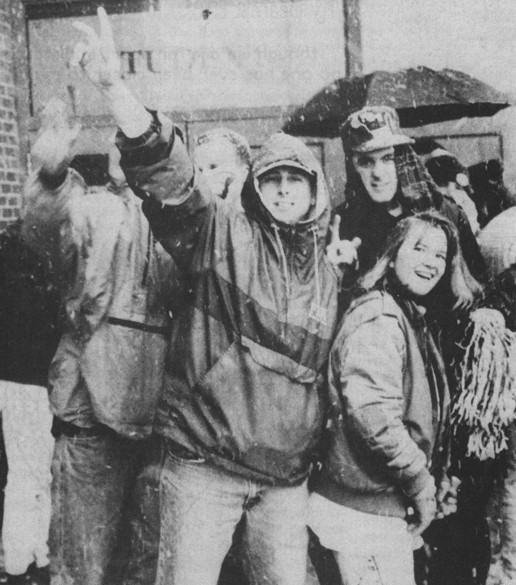 Many eager Mississippi State University students wait outside Humphrey Coliseum in the snow for seats at the Auburn-State basketball game.