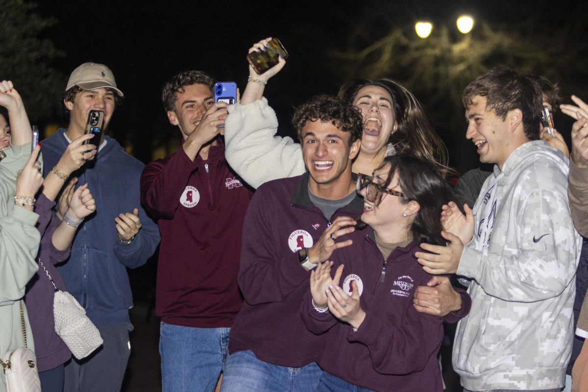 Keegan Figueroa gleefully grabs Abigail Spreen as he finds out they won on Tuesday night.