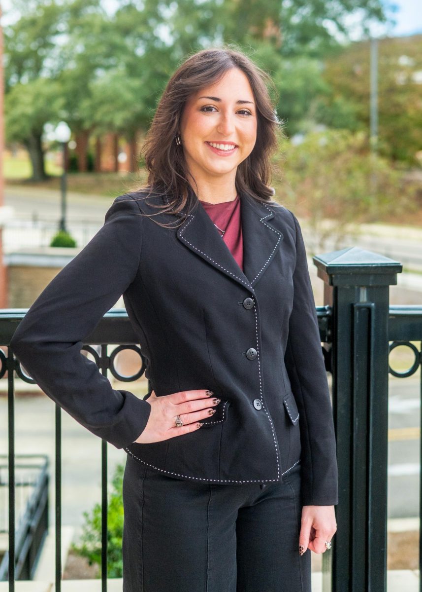 Student Association Vice Presidential Candidate Abigail Spreen smiles for a photo at Old Main Academic Center.