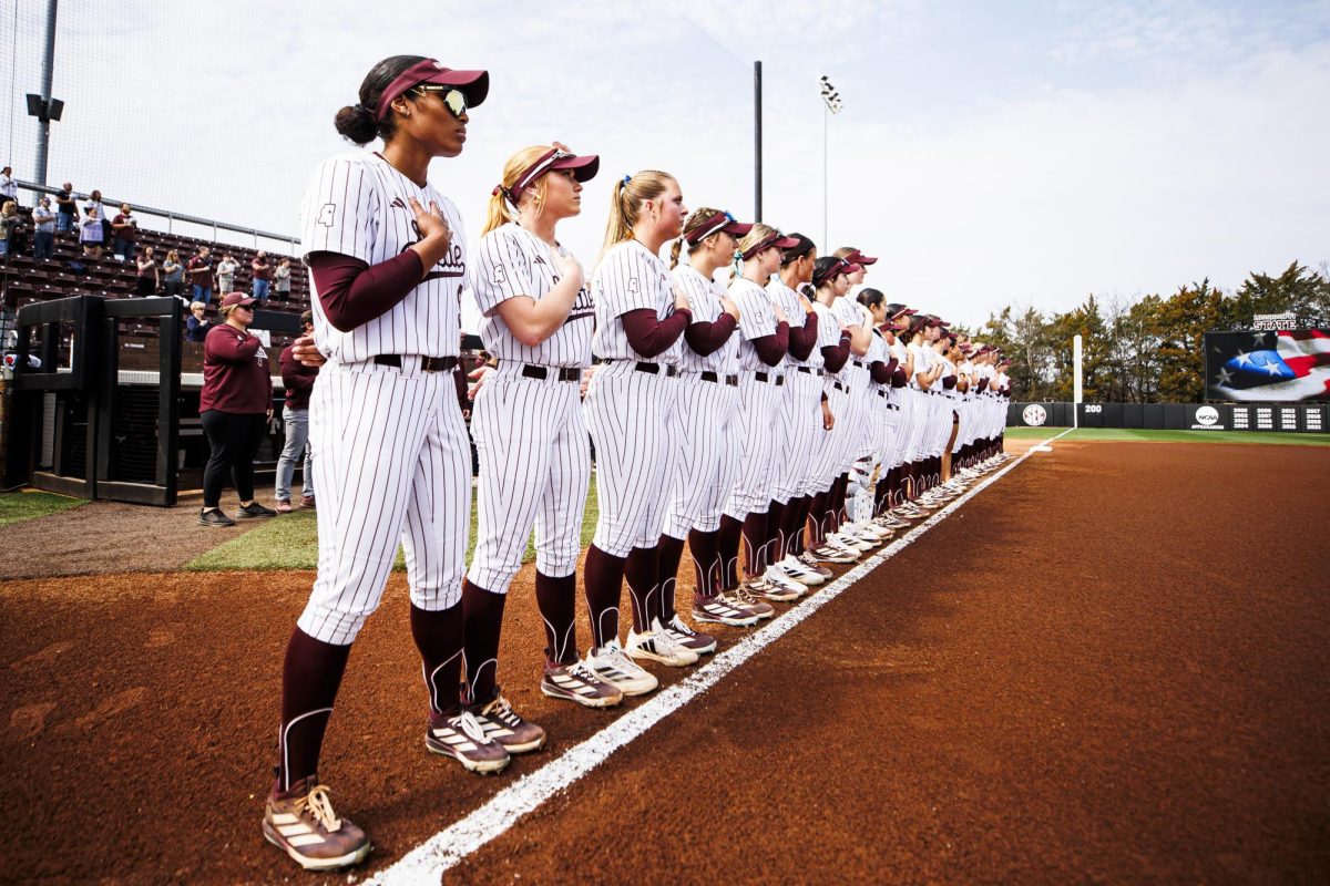 The MSU softball team lines up for the national anthem before the second game against Belmont University.