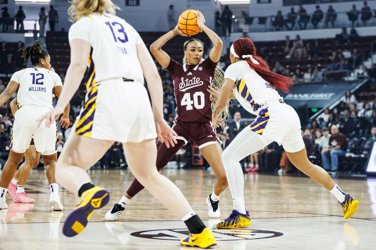 Freshman forward Madison Francis tries to navigate around LSU's defense during the game on March 1, 2026