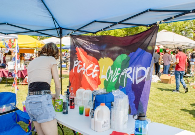 F.L.A.R.E. (Fostering LGBTQ+ Advocacy, Resources and Environments) tabling at the Drill Field during the International Fiesta.