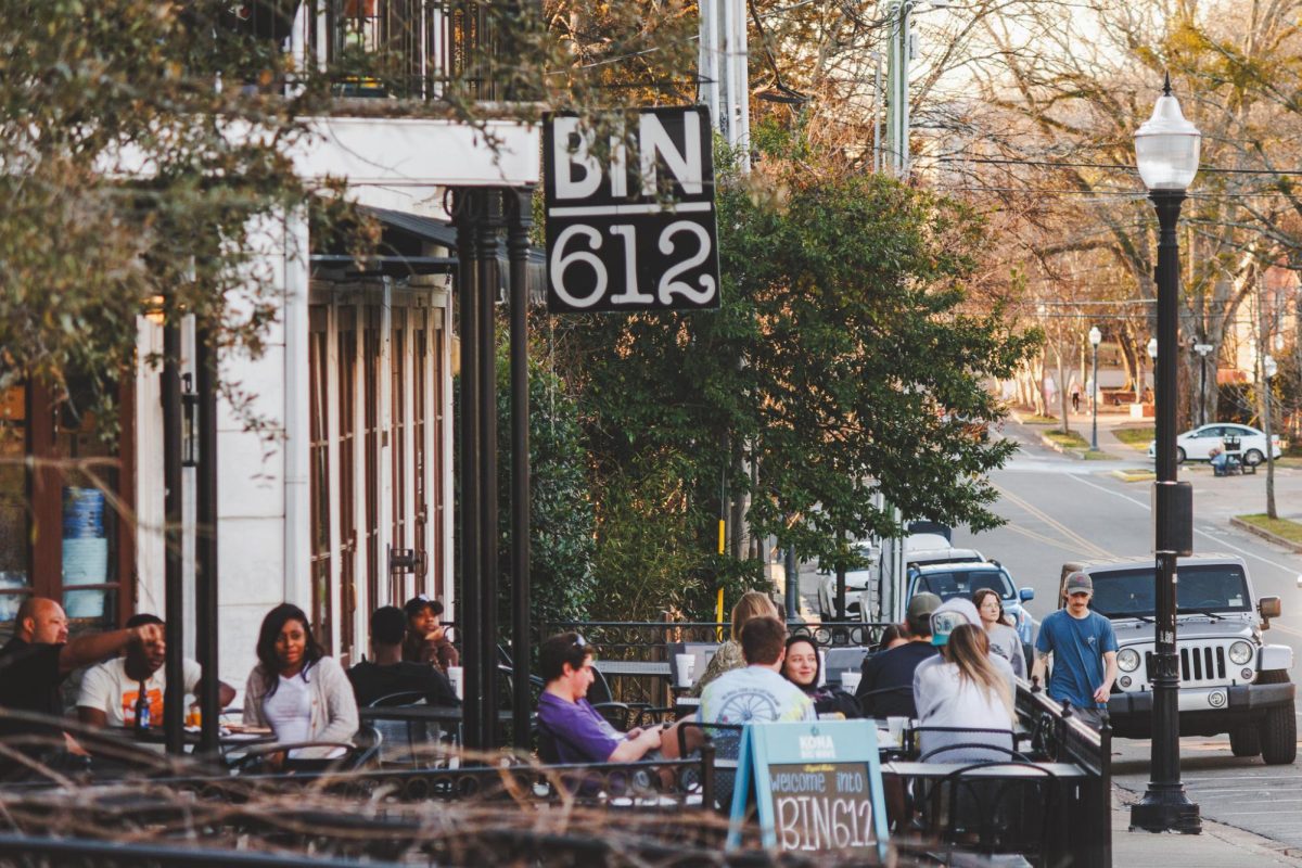 Customers sit outside at Bin 612.