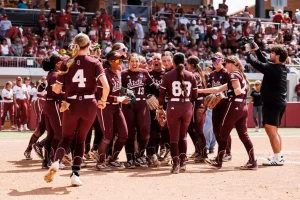 The Bulldogs celebrate a win after the first game of the Super Regional series.