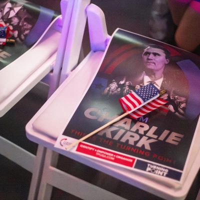 5:38 p.m. - Charlie Kirk tribute posters and American flags were placed on each seat prior to the event.