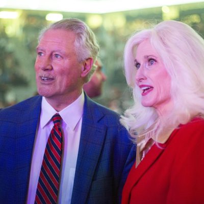 5:45 p.m. - University of Mississippi Glenn Boyce and wife, Emily, stand looking at the stage.