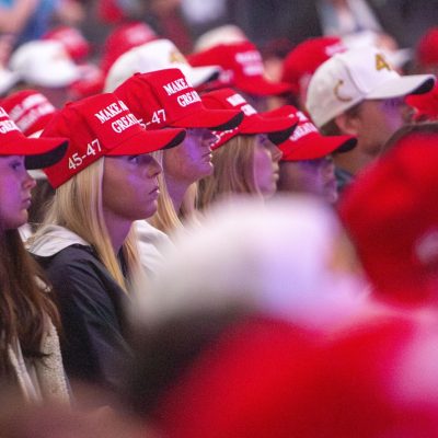6:56 p.m. - The floor of the pavilion was a sea of red and white caps in support of the MAGA campaign.