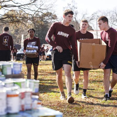 November 22, 2025 - 10:34 AM - Mississippi State Army ROTC Cadets add food to the pile donated to the Calhoun City Baptist and Methodist associations.