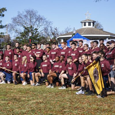 November 22, 2025 - 10:38 AM - Mississippi State Army ROTC and Air Force ROTC members smile for a photo in the Calhoun City square during the Egg Bowl Run.