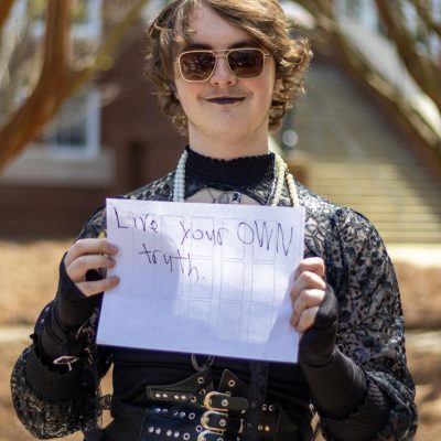 Owen Bale stood nearby with his homemade sign, "Live your OWN truth." When Smock read his sign, she responded "Jesus is the way, the truth and the life."