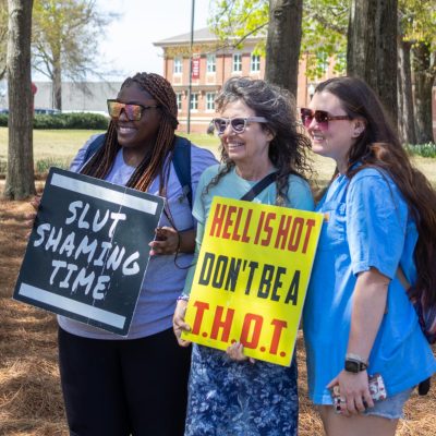 Smock brought several props to her speech, including two signs she would motion to.